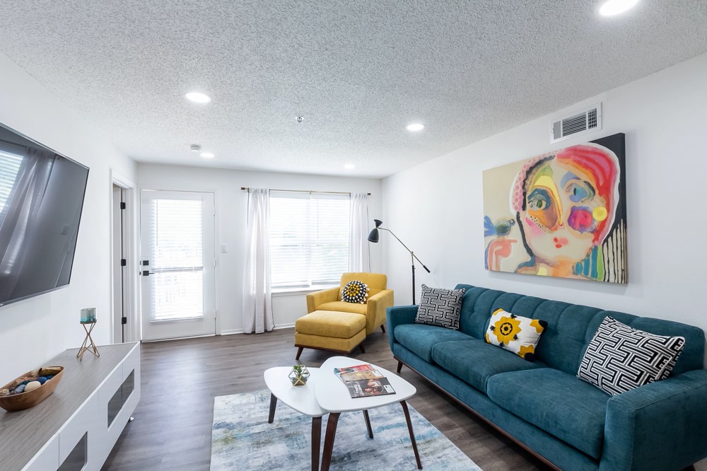 835 Oglethorpe Avenue Southwest Atlanta, GA 30310 - Photo 16 of 39 a living room with furniture and a flat screen tv