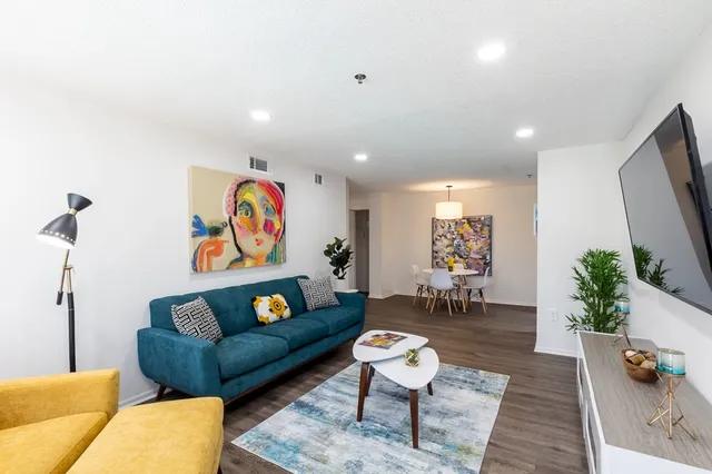 a kitchen with stainless steel appliances a stove microwave and a refrigerator