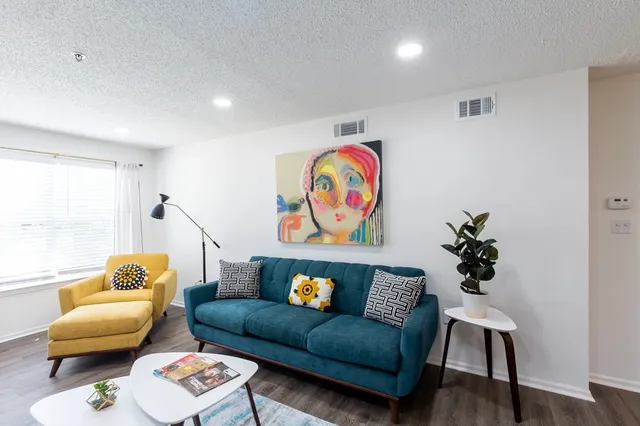 a kitchen with a sink a refrigerator a stove and cabinets
