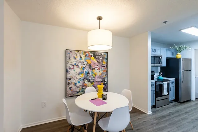 a bedroom with a bed and a lamp