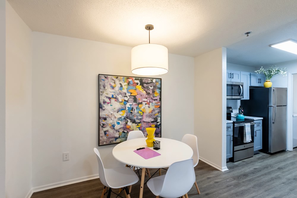 835 Oglethorpe Avenue Southwest Atlanta, GA 30310 - Photo 22 of 39 a view of a dining room with furniture and wooden floor