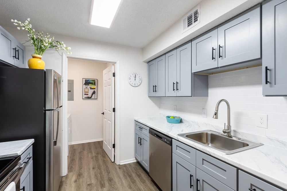 835 Oglethorpe Avenue Southwest Atlanta, GA 30310 - Photo 24 of 39 a kitchen with a sink a refrigerator a stove and cabinets