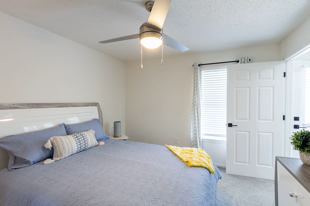 835 Oglethorpe Avenue Southwest Atlanta, GA 30310 - Photo 32 of 39 a bedroom with a bed and a lamp