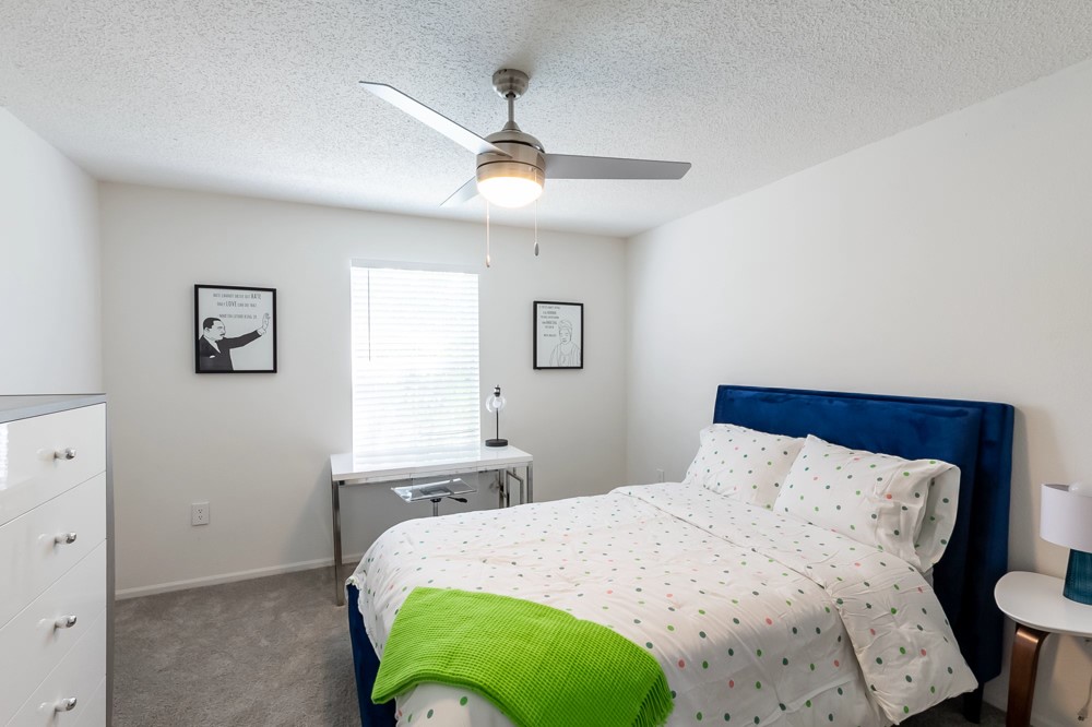 835 Oglethorpe Avenue Southwest Atlanta, GA 30310 - Photo 35 of 39 a bedroom with a bed and a chandelier