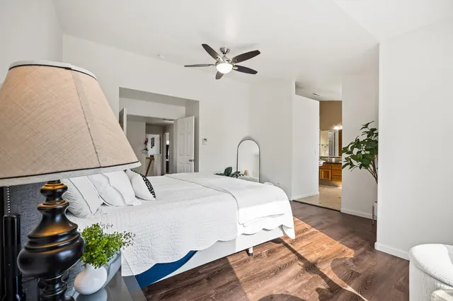 a bedroom with a bed and a mirror