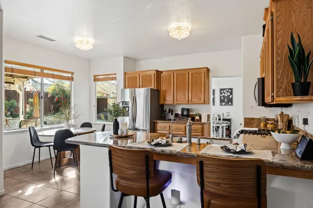 a kitchen with a sink and wooden cabinets