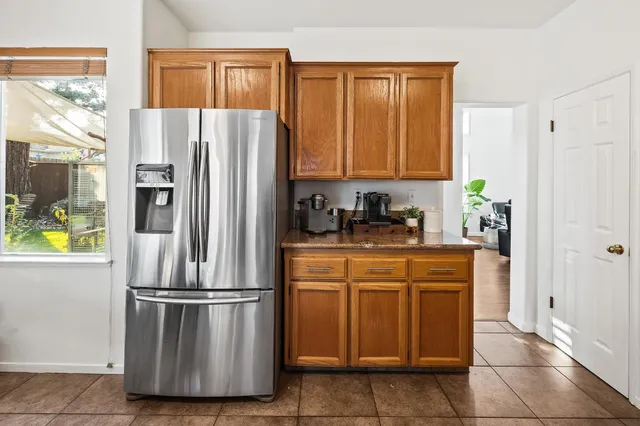 a kitchen with stainless steel appliances a refrigerator and a stove
