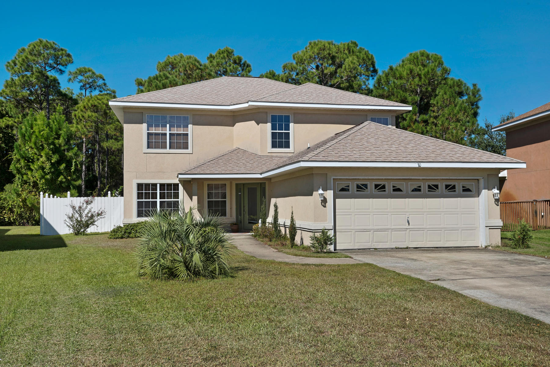 30 Red Maple Court Santa Rosa Beach, FL 32459 - Photo 1 of 36 a front view of a house with a yard