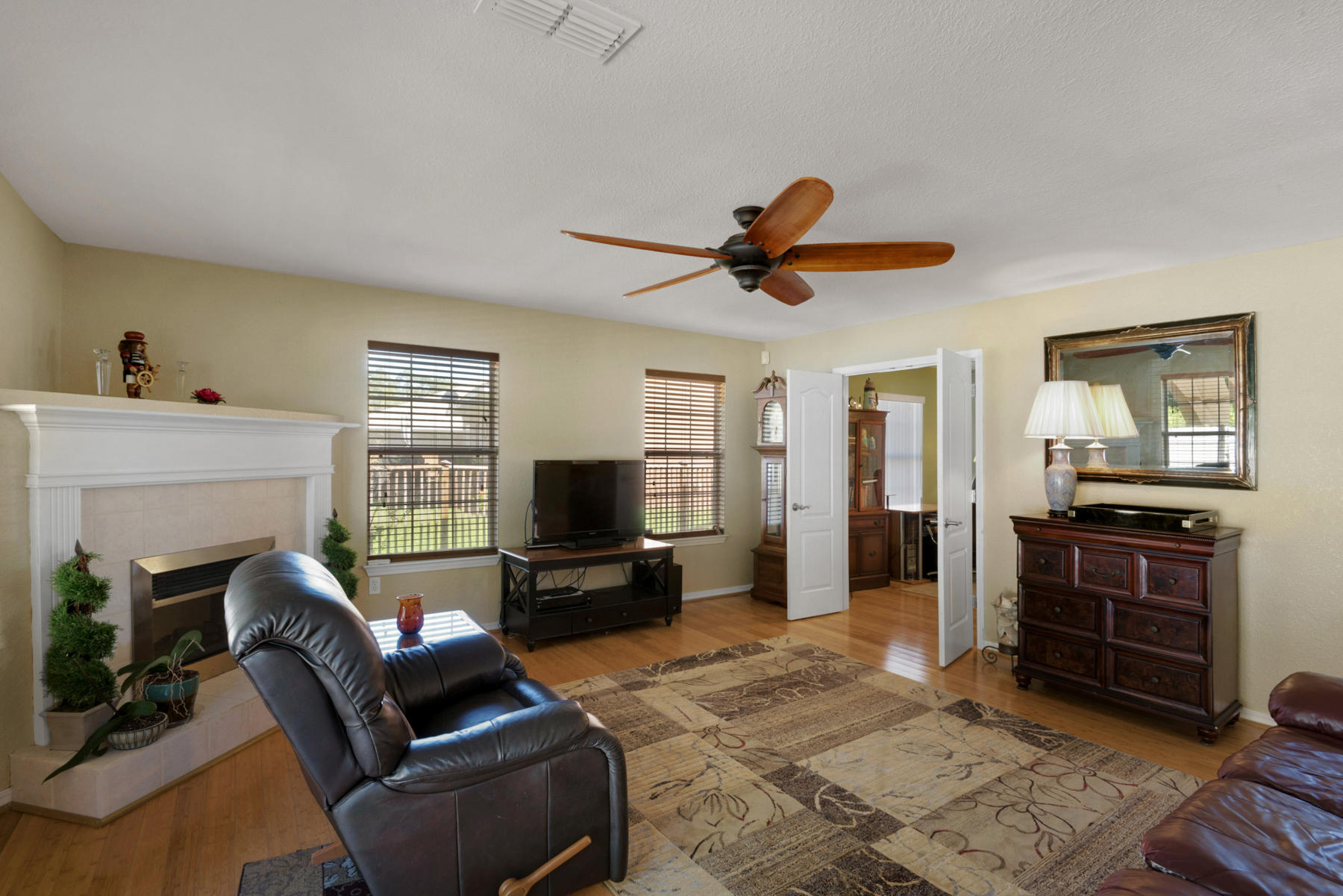 30 Red Maple Court Santa Rosa Beach, FL 32459 - Photo 12 of 36 a living room with furniture a fireplace and a flat screen tv