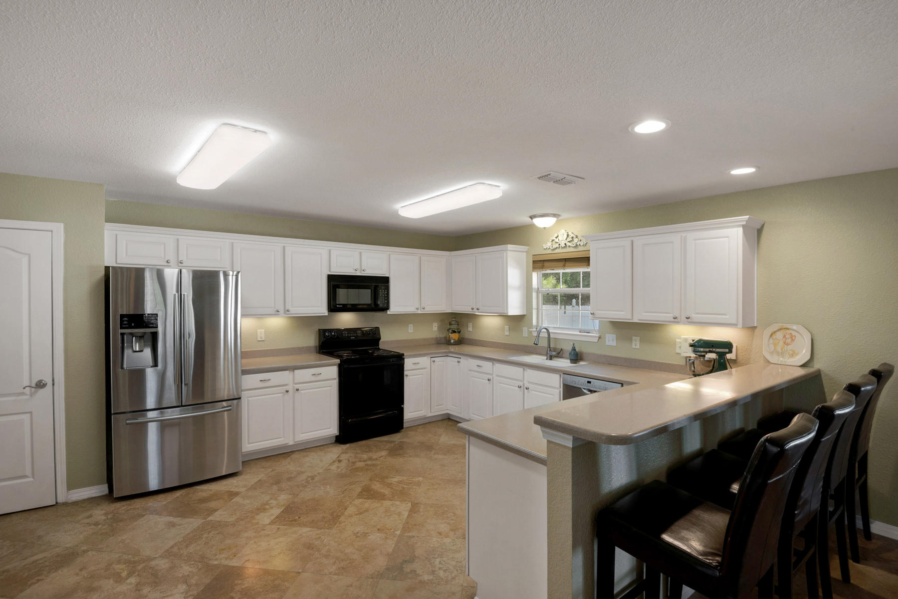 30 Red Maple Court Santa Rosa Beach, FL 32459 - Photo 21 of 36 a kitchen with a sink stainless steel appliances and white cabinets