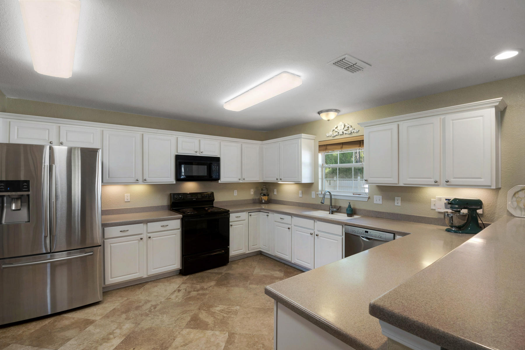 30 Red Maple Court Santa Rosa Beach, FL 32459 - Photo 22 of 36 a kitchen with a sink a stove and refrigerator