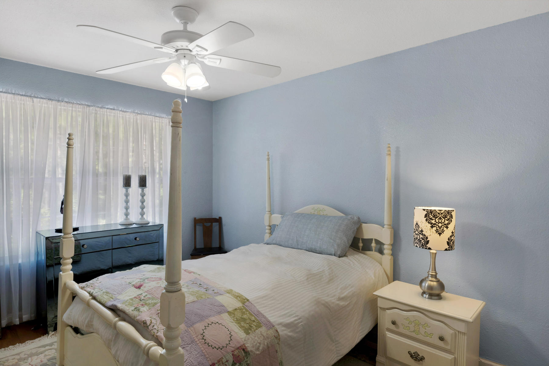 30 Red Maple Court Santa Rosa Beach, FL 32459 - Photo 31 of 36 a bedroom with a bed and a chandelier