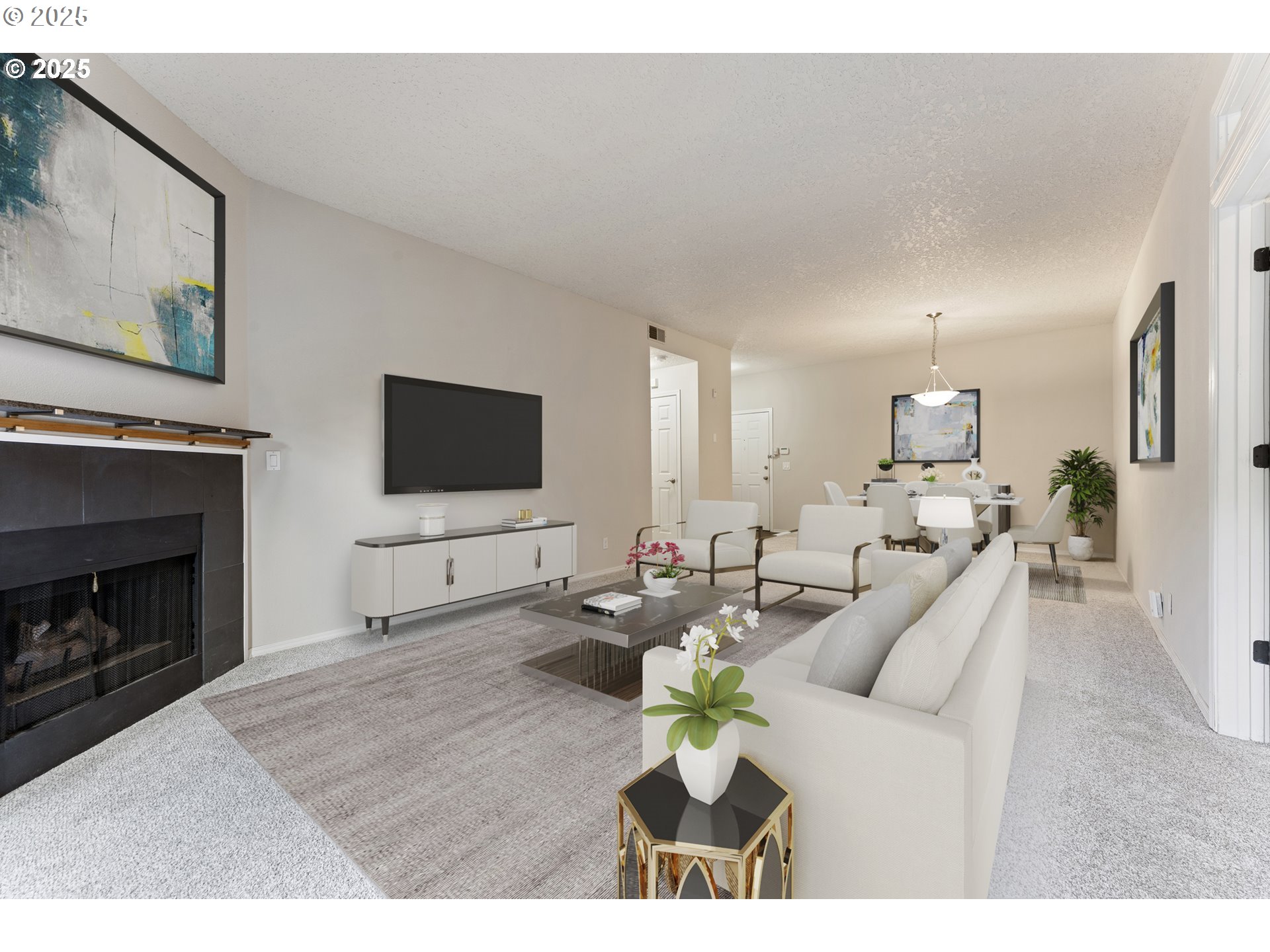 4320 South Corbett Avenue, Unit 202 Portland, OR 97239 - Photo 22 of 33 a living room with furniture a fireplace and a flat screen tv