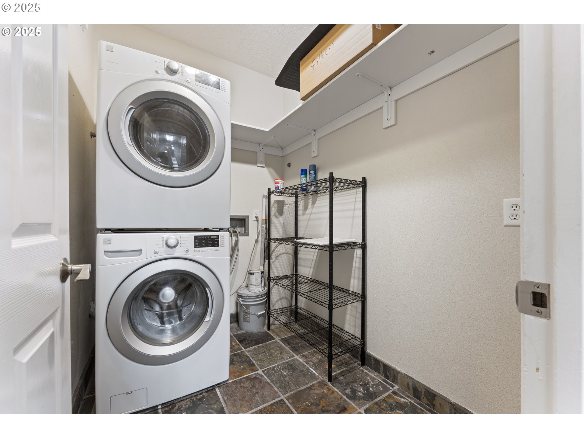 4320 South Corbett Avenue, Unit 202 Portland, OR 97239 - Photo 29 of 33 a view of a hallway with washer and dryer