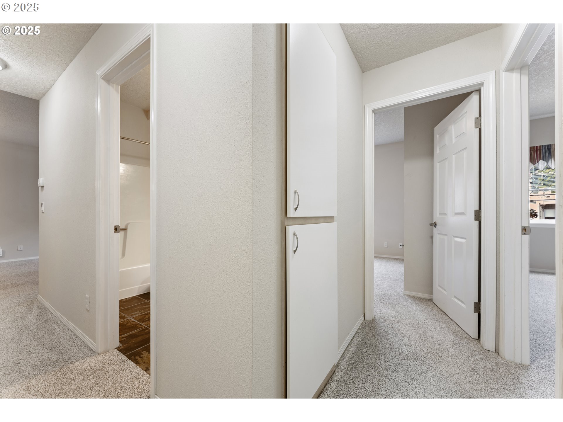 4320 South Corbett Avenue, Unit 202 Portland, OR 97239 - Photo 3 of 33 a view of a bathroom from a hallway