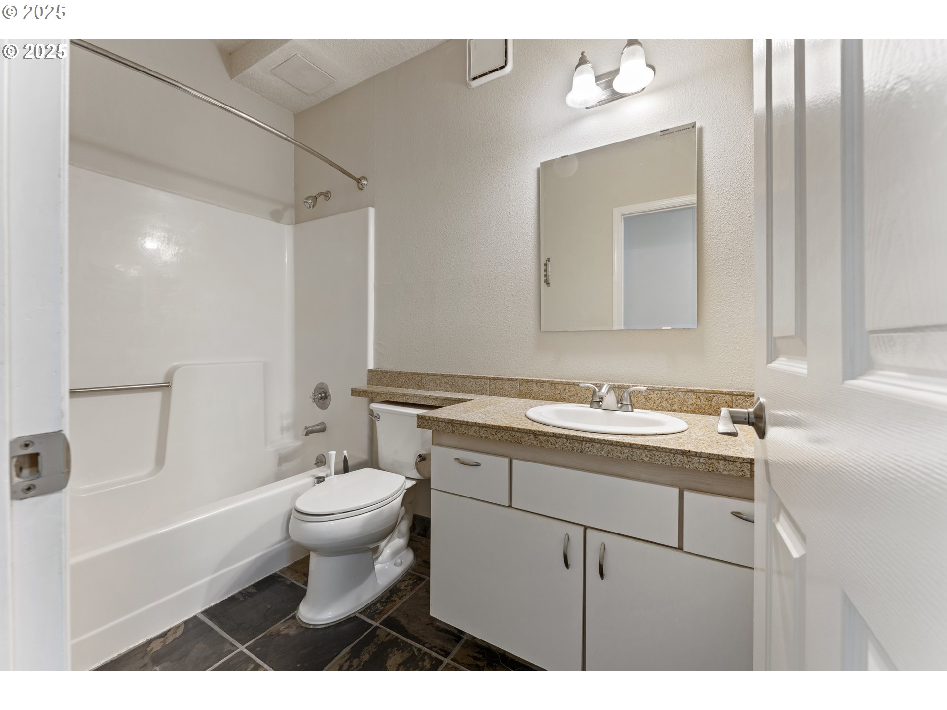 4320 South Corbett Avenue, Unit 202 Portland, OR 97239 - Photo 4 of 33 a bathroom with a sink toilet and shower