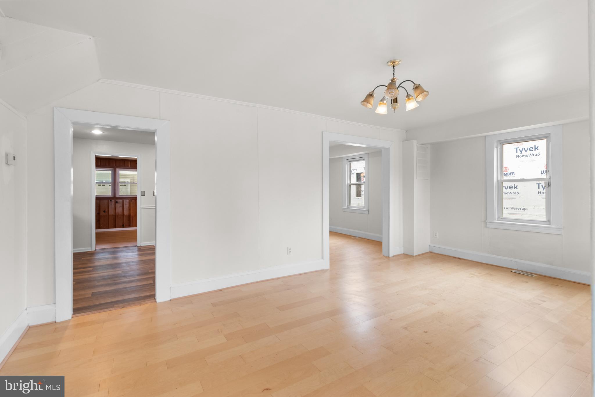 1504 Taylor Avenue, Unit A Parkville, MD 21234 - Photo 11 of 27 wooden floor in an empty room with a window