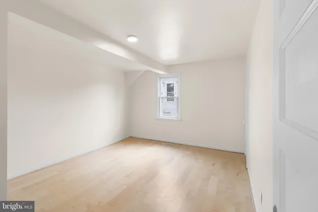 a white toilet sitting next to a bath tub