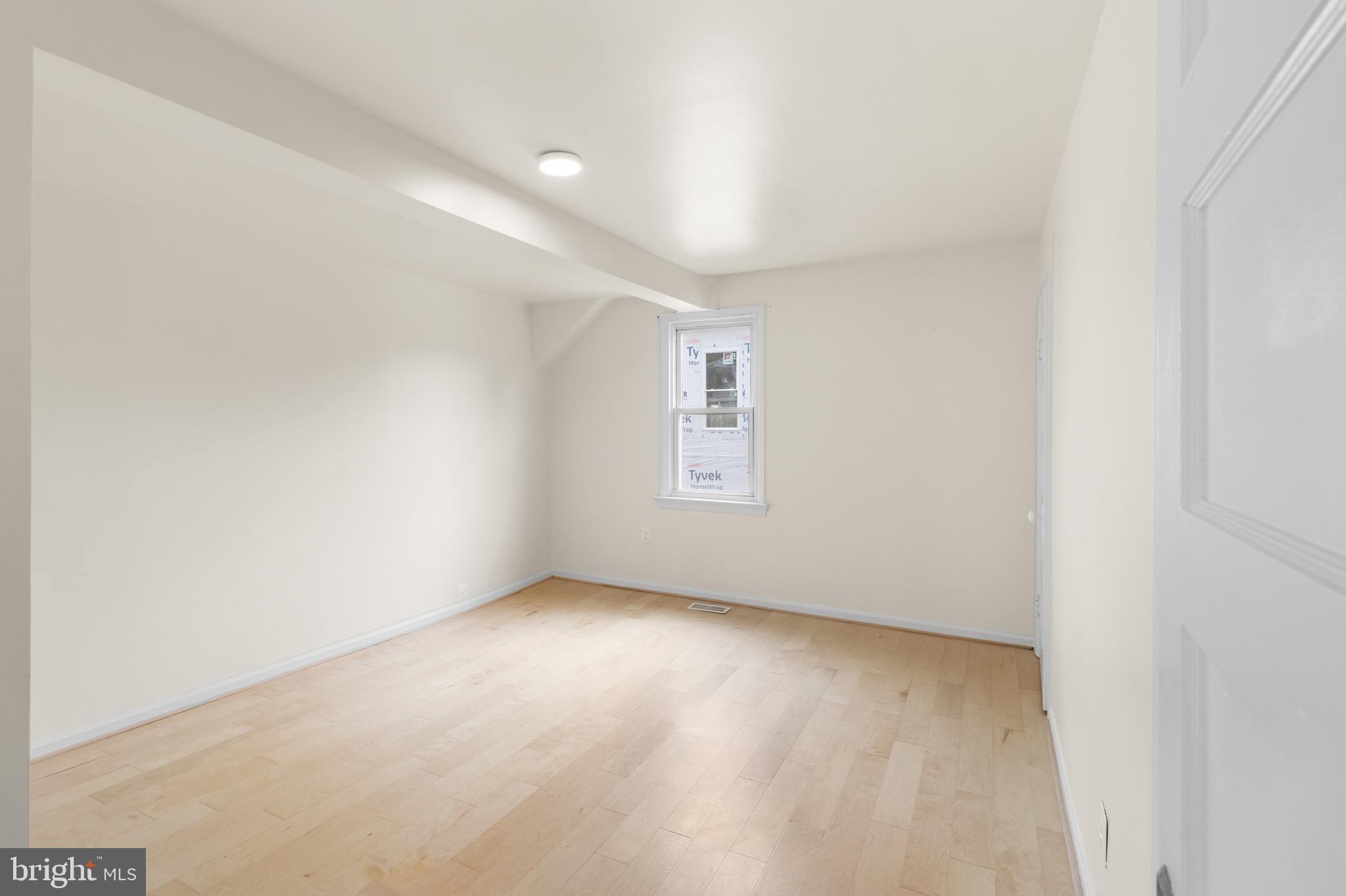 1504 Taylor Avenue, Unit A Parkville, MD 21234 - Photo 17 of 27 an empty room with windows