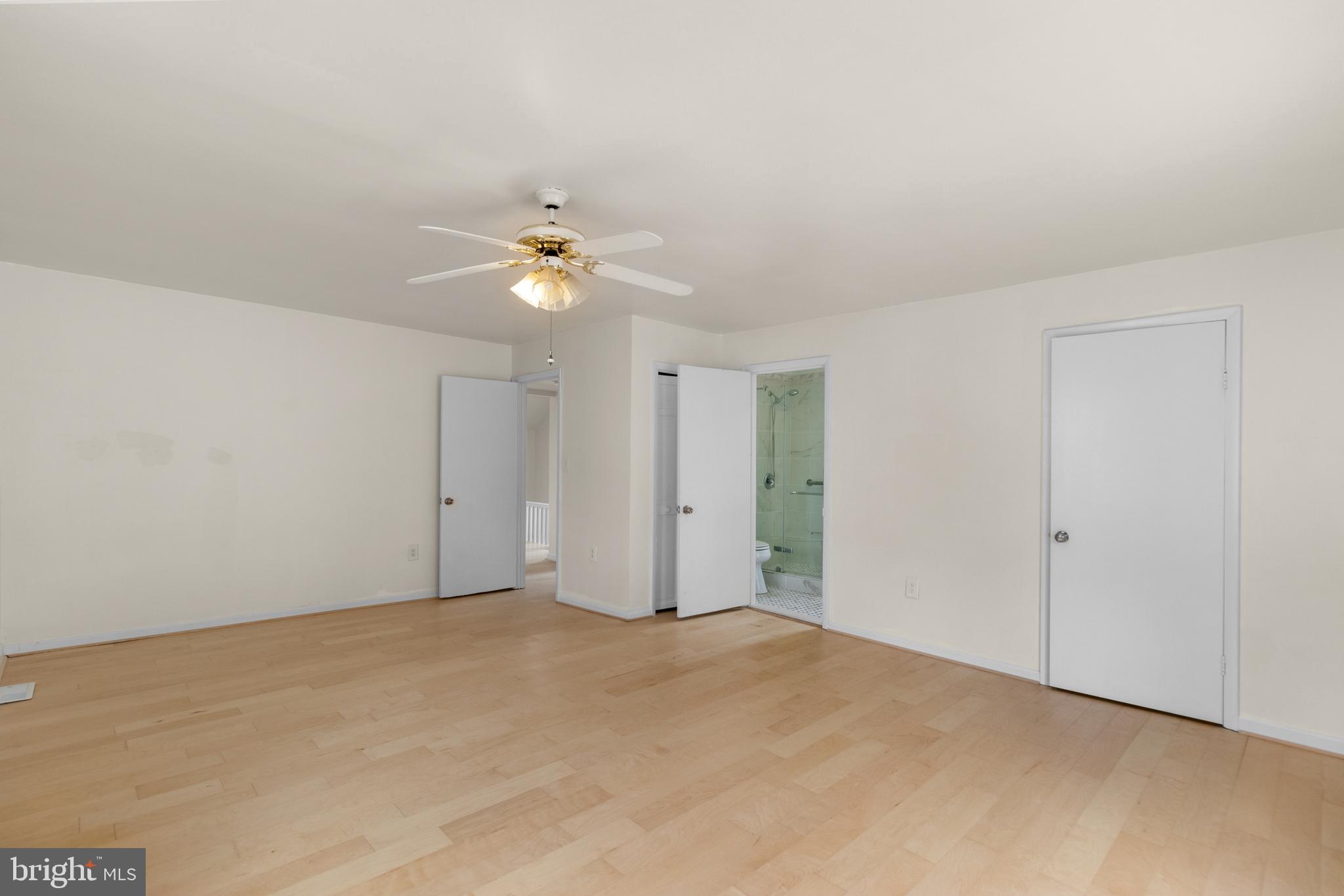 1504 Taylor Avenue, Unit A Parkville, MD 21234 - Photo 21 of 27 a view of an empty room with a ceiling fan