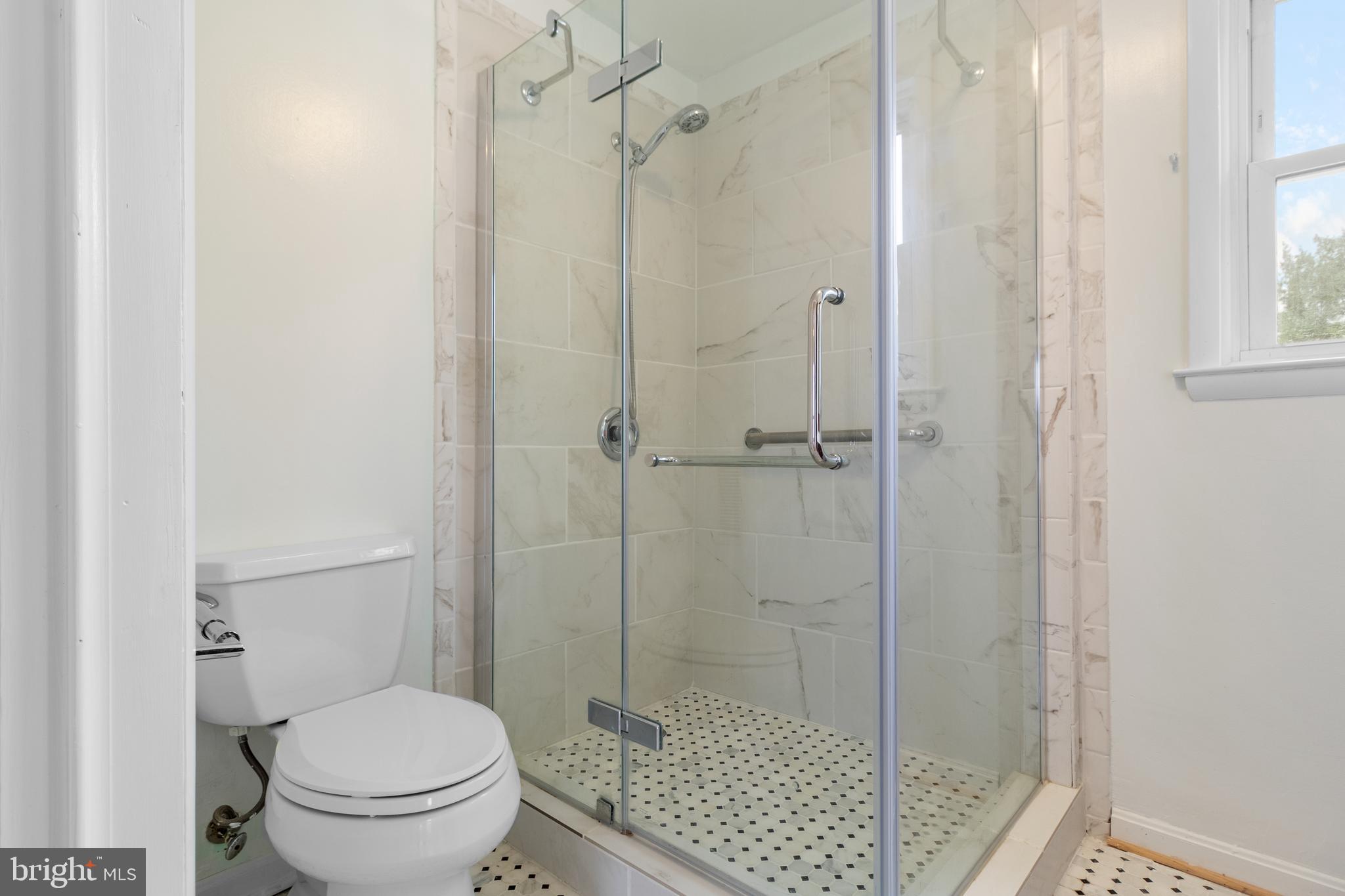 1504 Taylor Avenue, Unit A Parkville, MD 21234 - Photo 25 of 27 a bathroom with a toilet and a shower