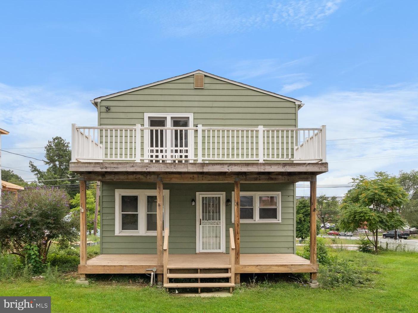 1504 Taylor Avenue, Unit A Parkville, MD 21234 - Photo 3 of 27 a front view of a house with a garden