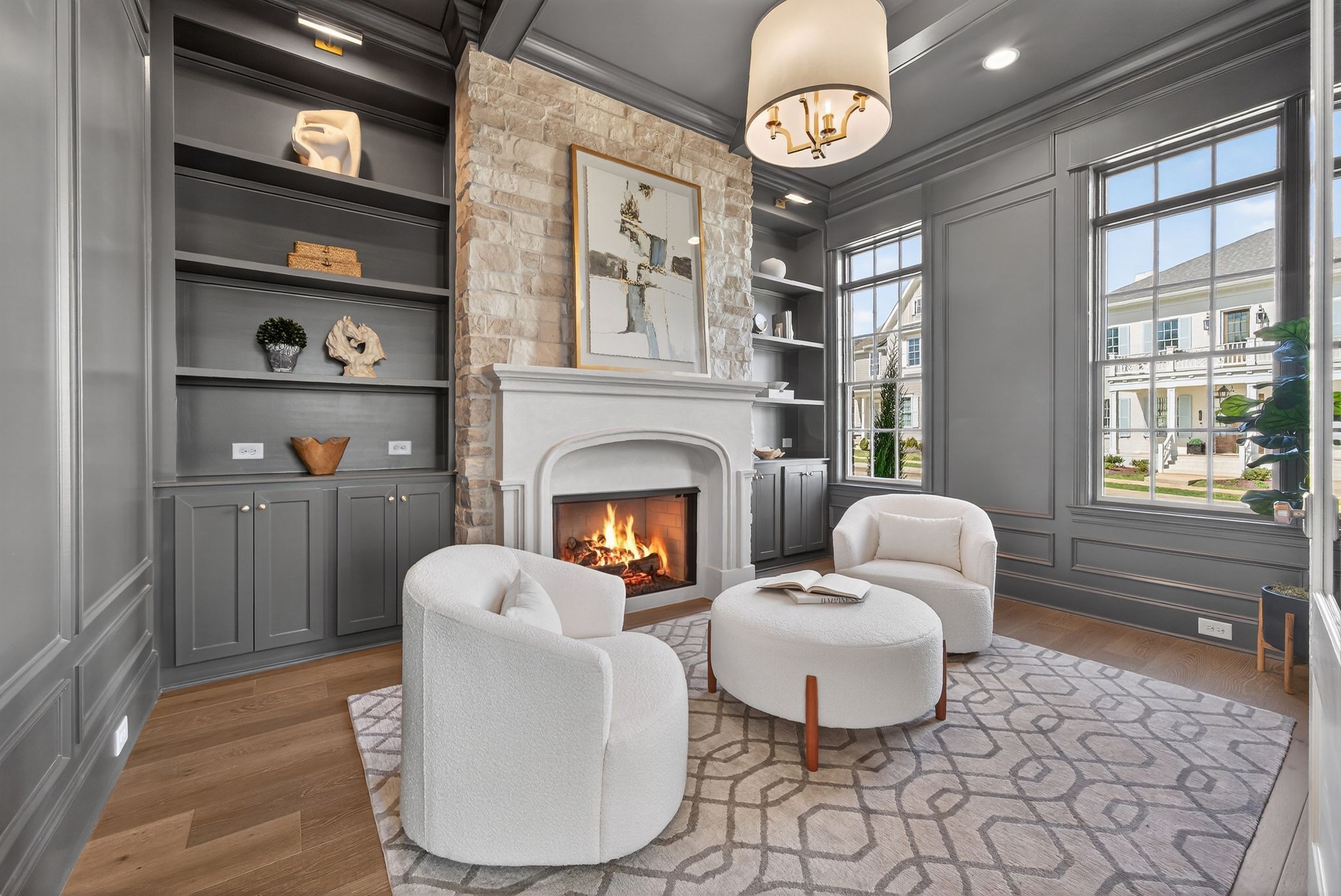 7042 Kinderhook Road Nashville, TN 37221 - Photo 11 of 87 a living room with furniture a fireplace and a table