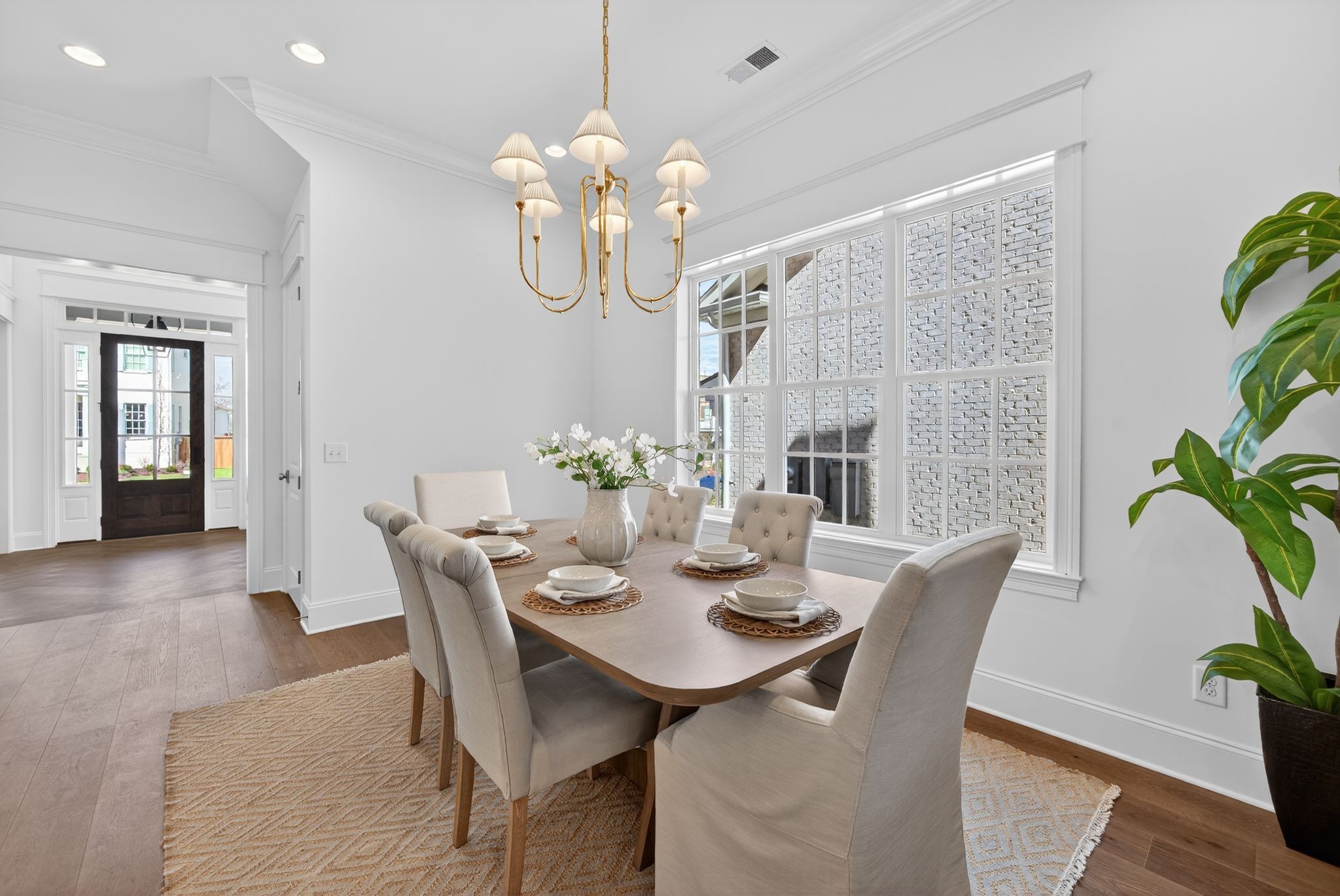 7042 Kinderhook Road Nashville, TN 37221 - Photo 18 of 87 a view of a dining room with furniture wooden floor and chandelier