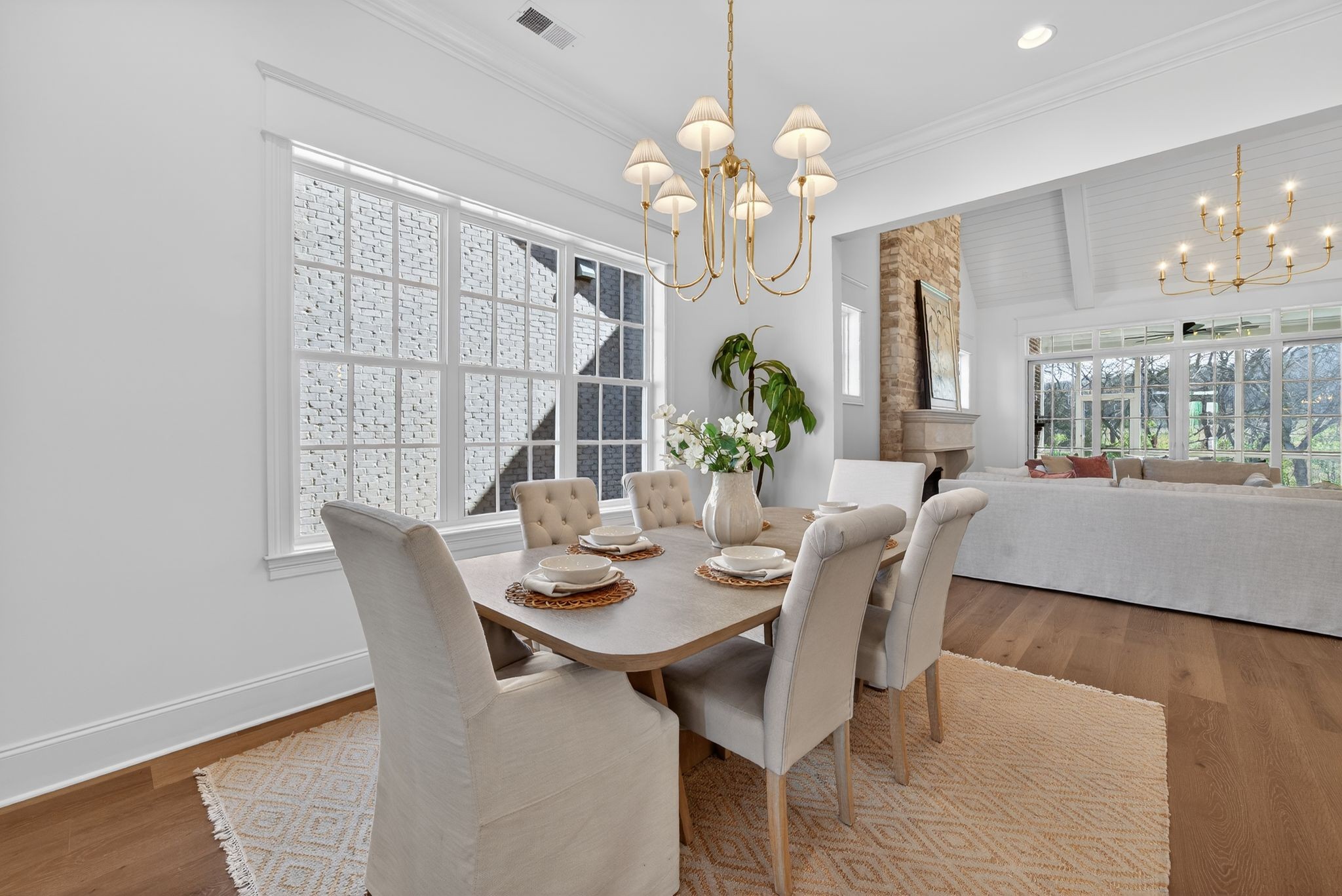 7042 Kinderhook Road Nashville, TN 37221 - Photo 19 of 87 a view of a dining room with furniture a chandelier and wooden floor