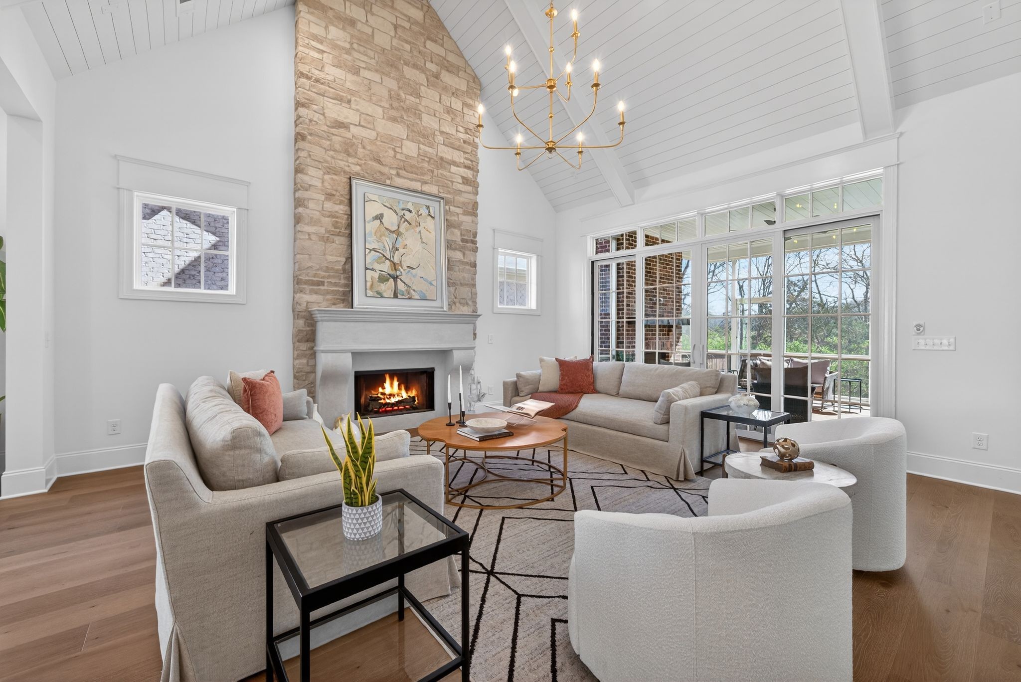 7042 Kinderhook Road Nashville, TN 37221 - Photo 21 of 87 a living room with furniture a large window and a fireplace
