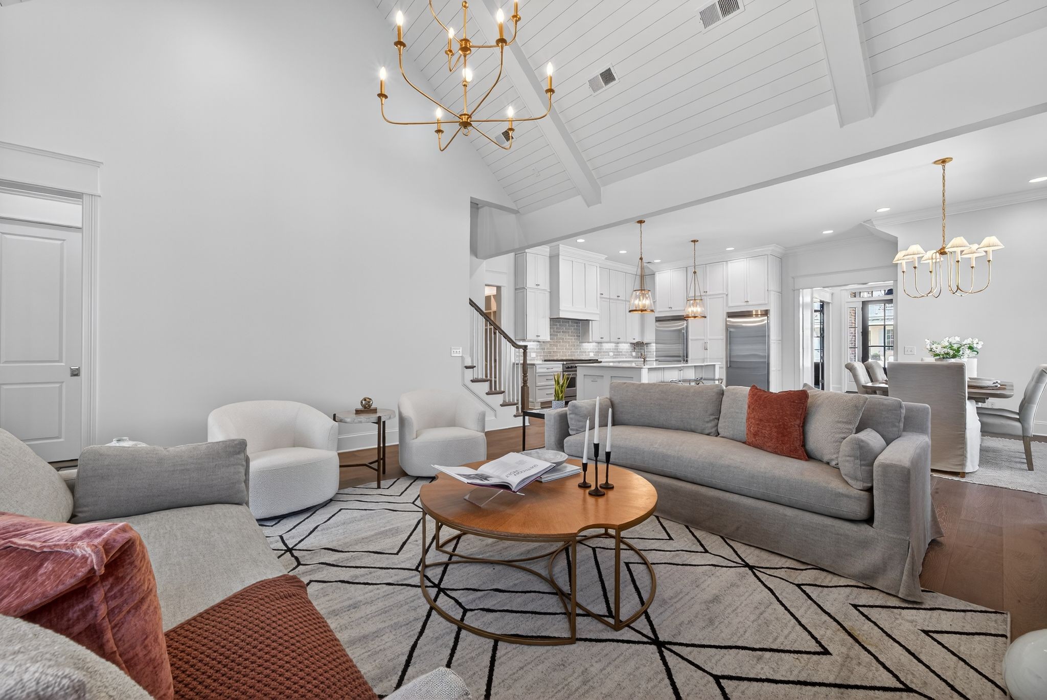 7042 Kinderhook Road Nashville, TN 37221 - Photo 24 of 87 a living room with furniture kitchen view and a chandelier