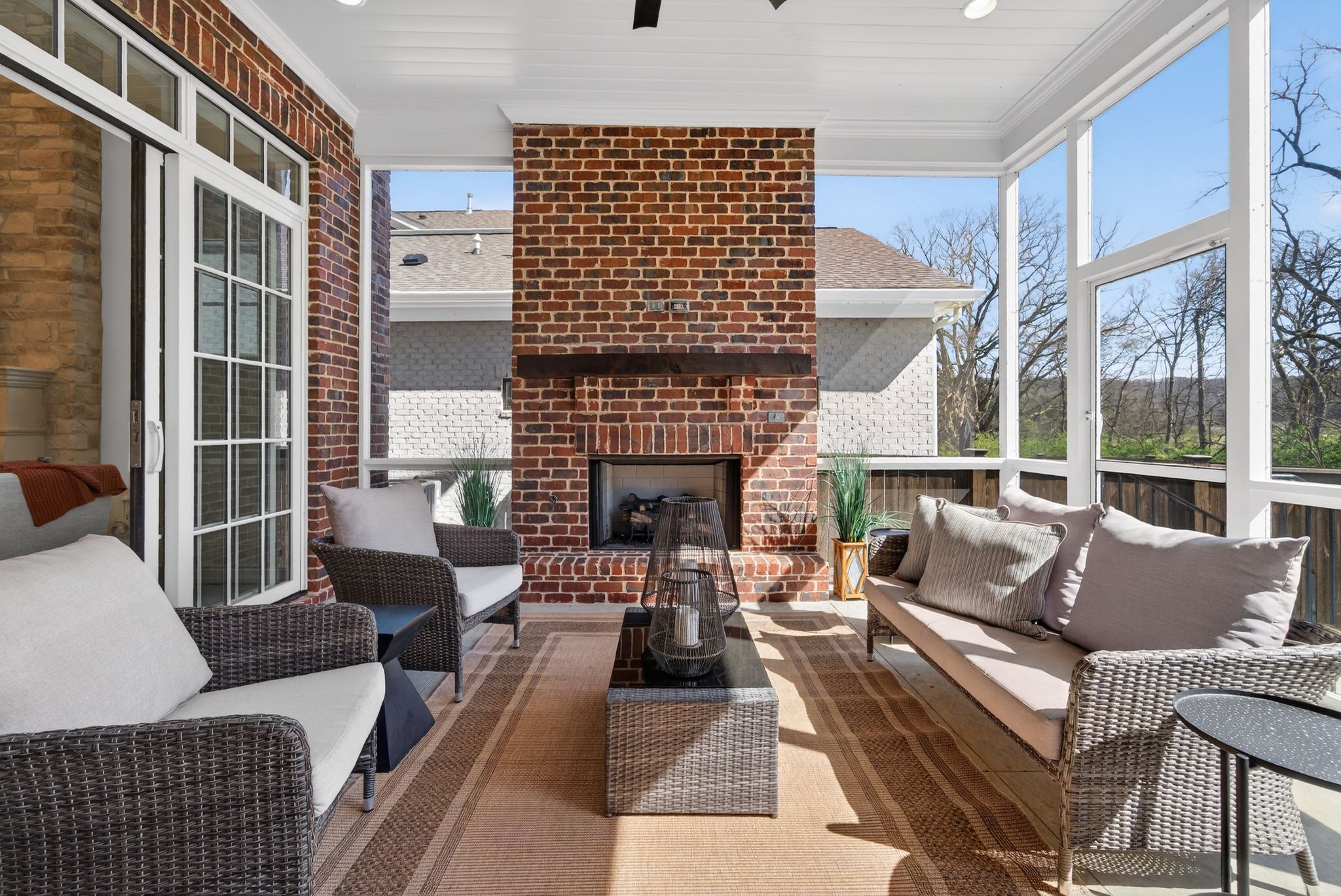 7042 Kinderhook Road Nashville, TN 37221 - Photo 29 of 87 a living room with furniture a fireplace and a large window