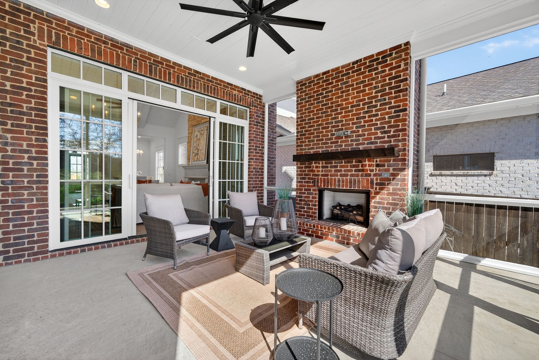 7042 Kinderhook Road Nashville, TN 37221 - Photo 30 of 87 a living room with furniture a fireplace and a flat screen tv