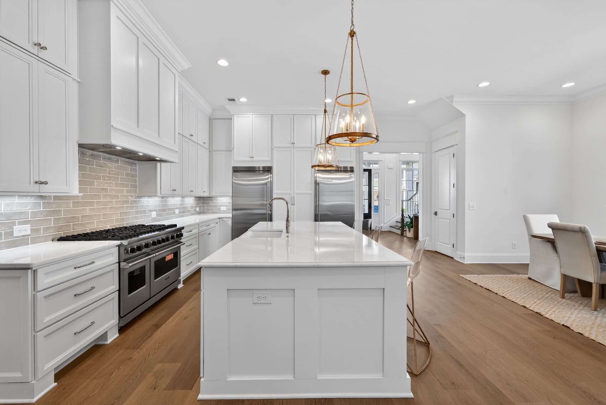 7042 Kinderhook Road Nashville, TN 37221 - Photo 32 of 87 a kitchen with a sink stainless steel appliances and white cabinets