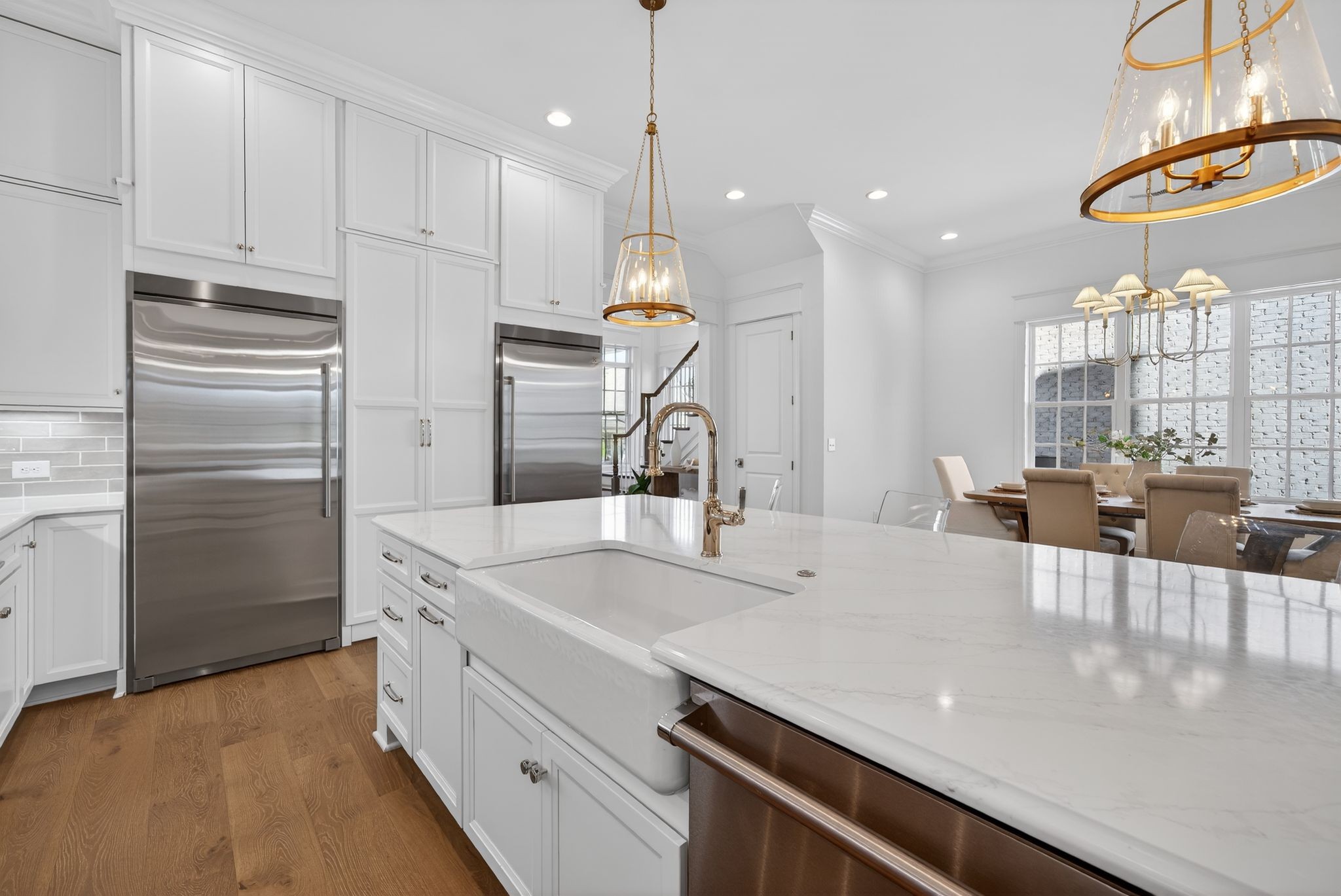 7042 Kinderhook Road Nashville, TN 37221 - Photo 34 of 87 a kitchen with kitchen island a sink stainless steel appliances and cabinets
