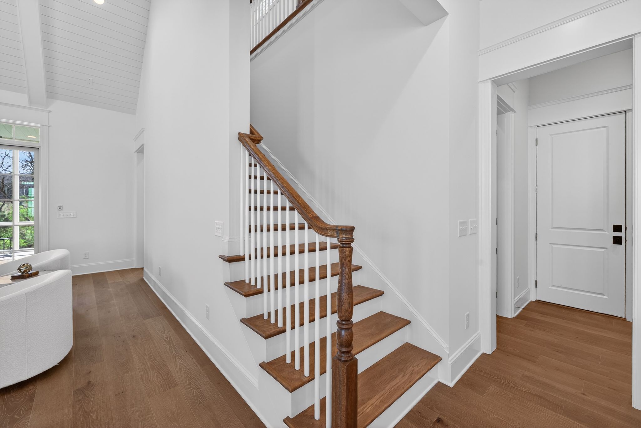 7042 Kinderhook Road Nashville, TN 37221 - Photo 38 of 87 a view of staircase with wooden floor and white walls