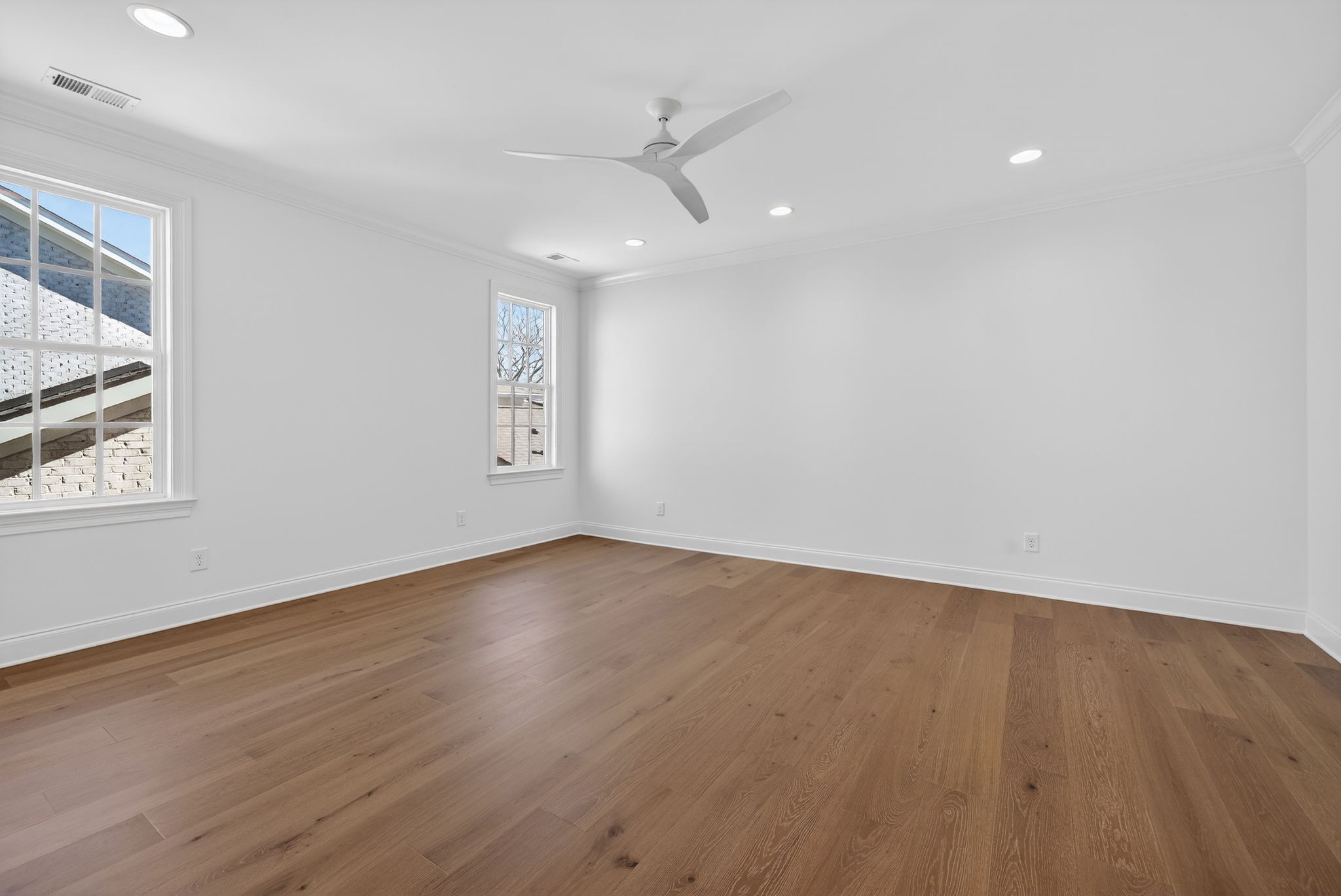 7042 Kinderhook Road Nashville, TN 37221 - Photo 61 of 87 an empty room with wooden floor and windows