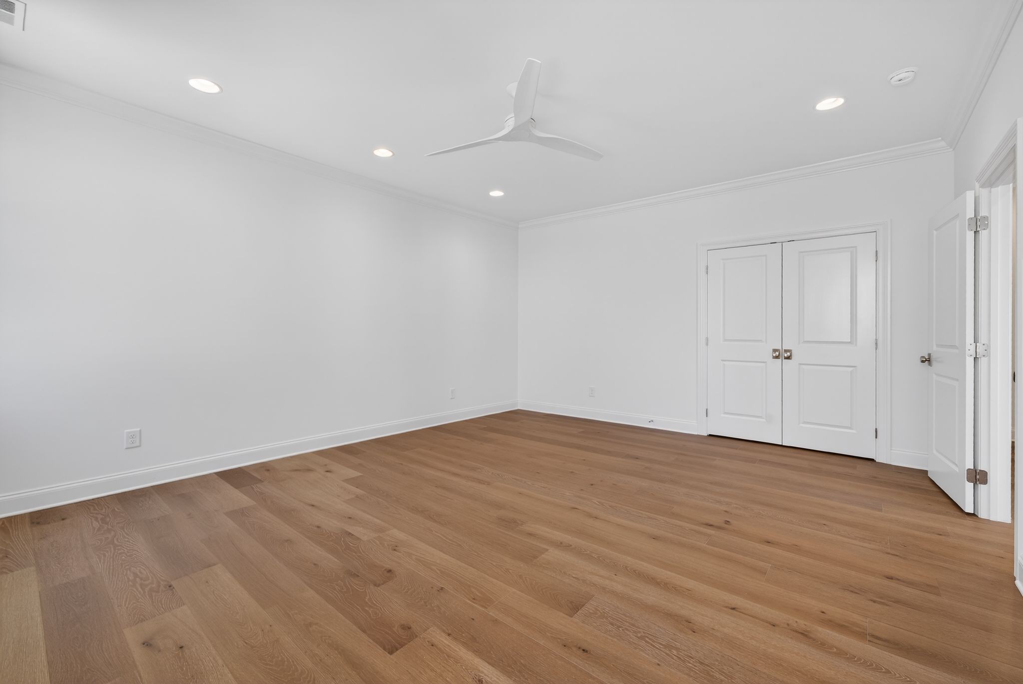 7042 Kinderhook Road Nashville, TN 37221 - Photo 62 of 87 an empty room with wooden floor and windows