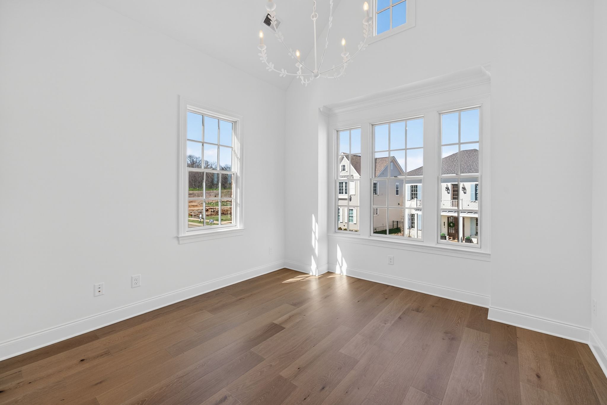 7042 Kinderhook Road Nashville, TN 37221 - Photo 66 of 87 an empty room with wooden floor and windows