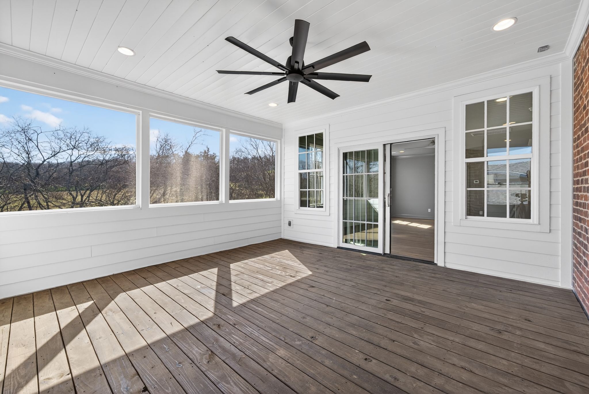 7042 Kinderhook Road Nashville, TN 37221 - Photo 80 of 87 a view of a room with wooden floor and a ceiling fan