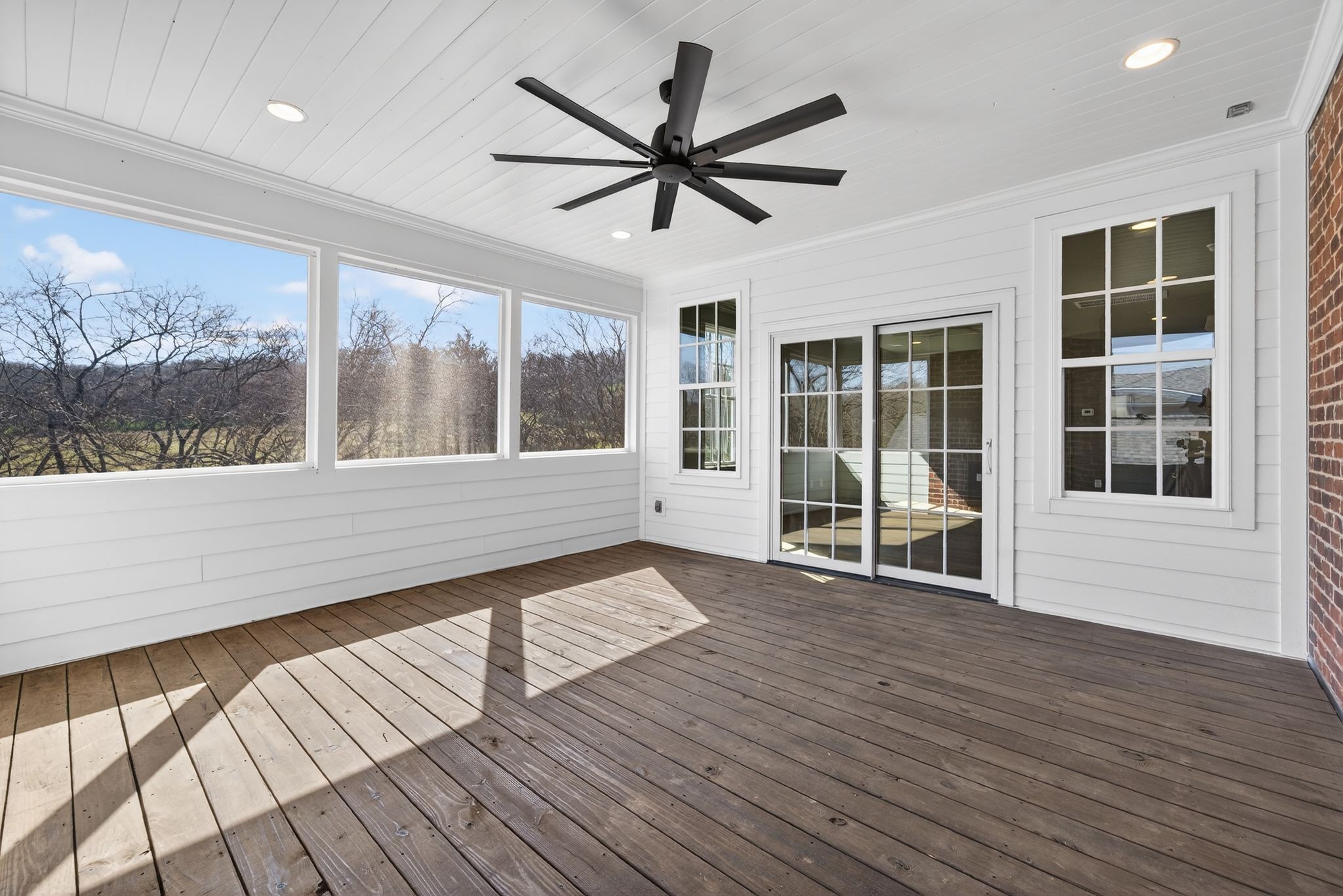 7042 Kinderhook Road Nashville, TN 37221 - Photo 81 of 87 a view of a room with wooden floor and a ceiling fan