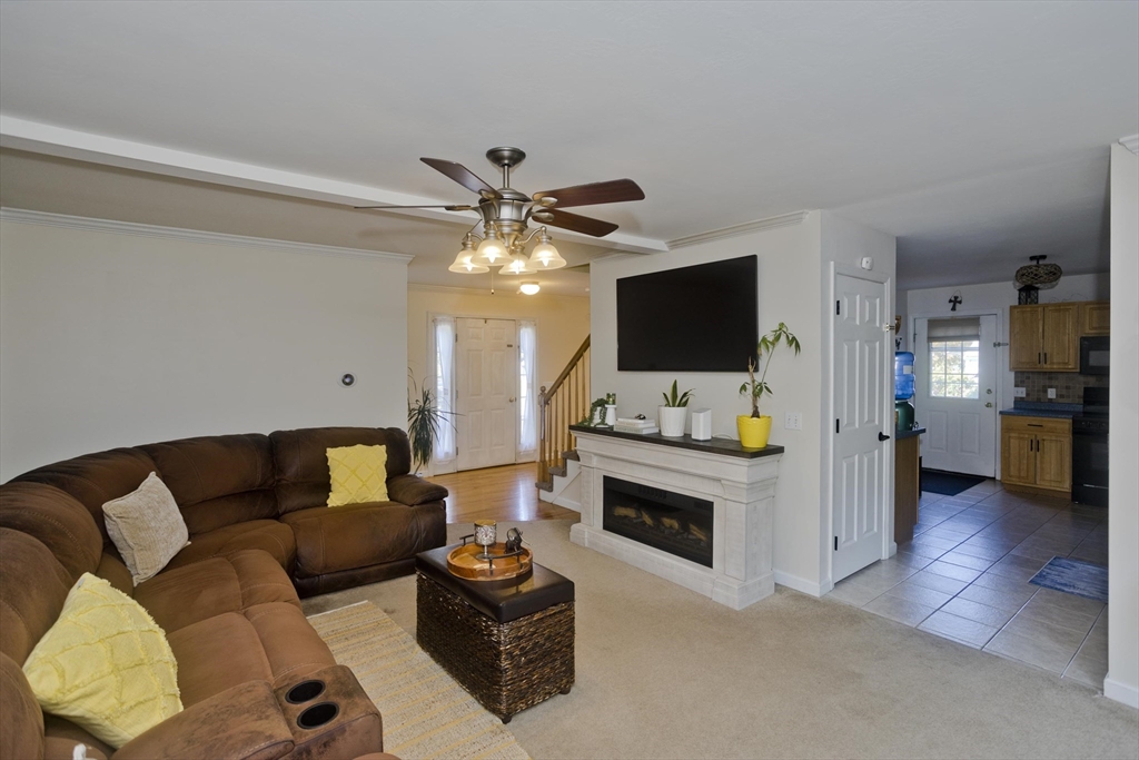 679 Parker Street Springfield, MA 01129 - Photo 42 of 42 a living room with furniture and a flat screen tv