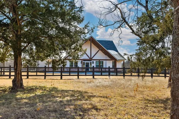a house with trees in front of it