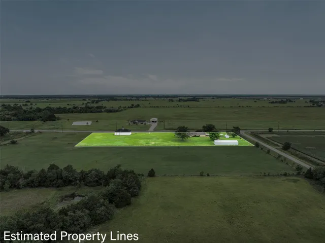 a view of a golf course with a field