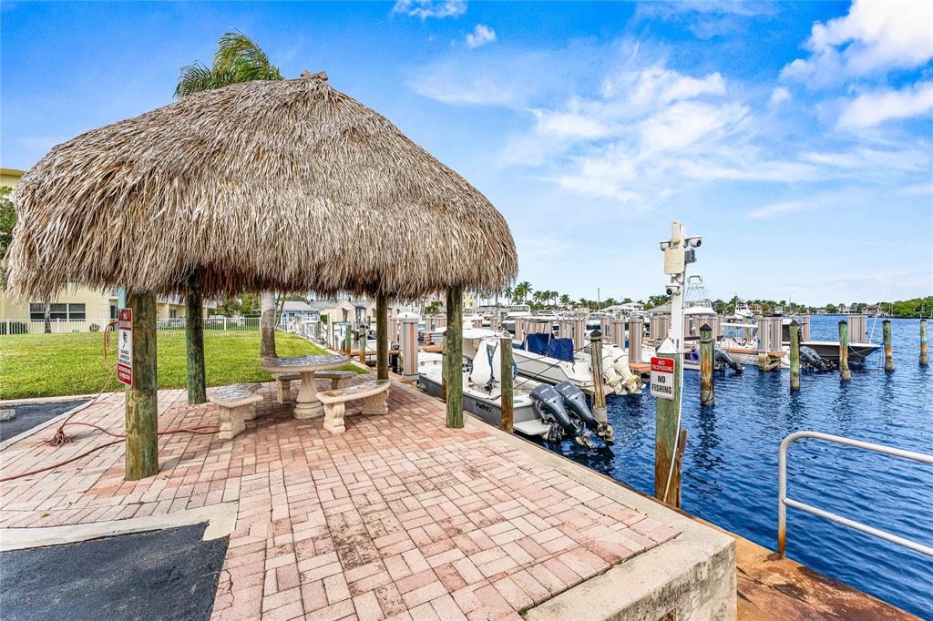 2758 Northeast 30th Avenue, Unit 1A Lighthouse Point, FL 33064 - Photo 42 of 48 a view of a terrace with sitting area