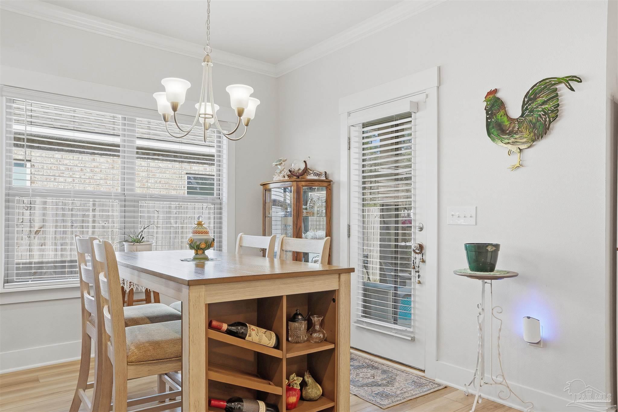 1932 Appleton Drive Cantonment, FL 32533 - Photo 11 of 57 a view of a dining room with furniture and chandelier