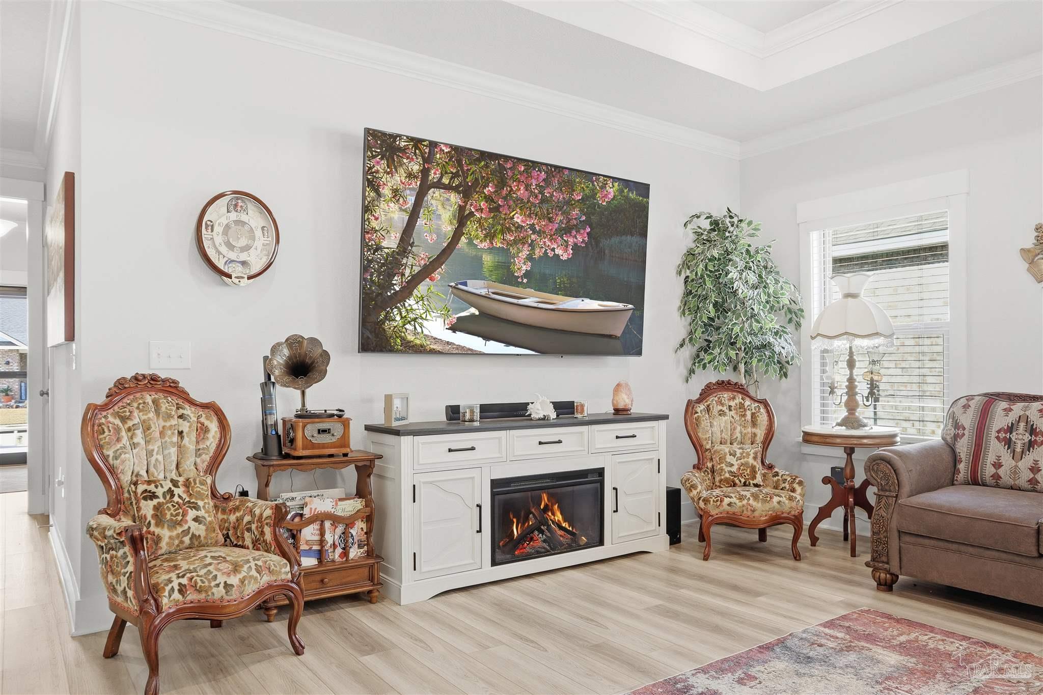 1932 Appleton Drive Cantonment, FL 32533 - Photo 13 of 57 a living room with furniture a clock and a large window