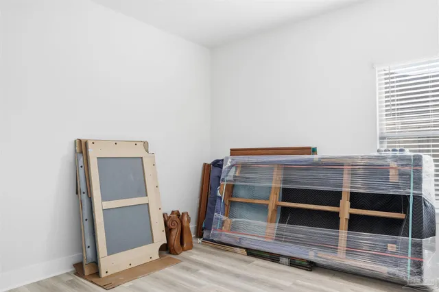 a bathroom with a granite countertop toilet and a sink