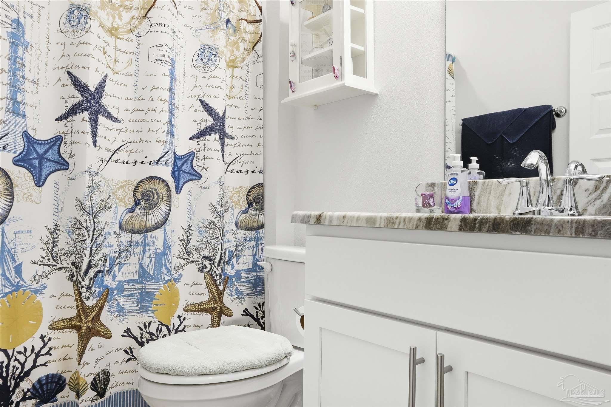 1932 Appleton Drive Cantonment, FL 32533 - Photo 25 of 57 a bathroom with a granite countertop toilet and a sink