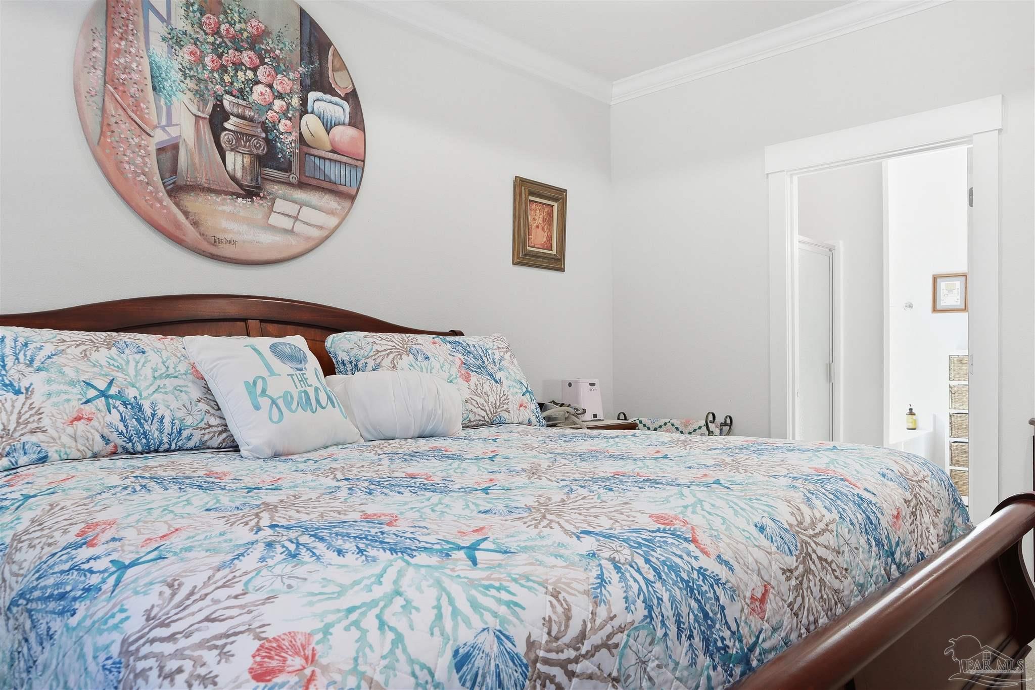 1932 Appleton Drive Cantonment, FL 32533 - Photo 27 of 57 a bedroom with a bed and a painting on the wall